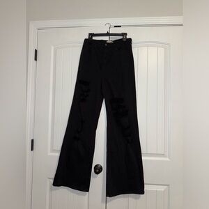 Black flared cut up jeans